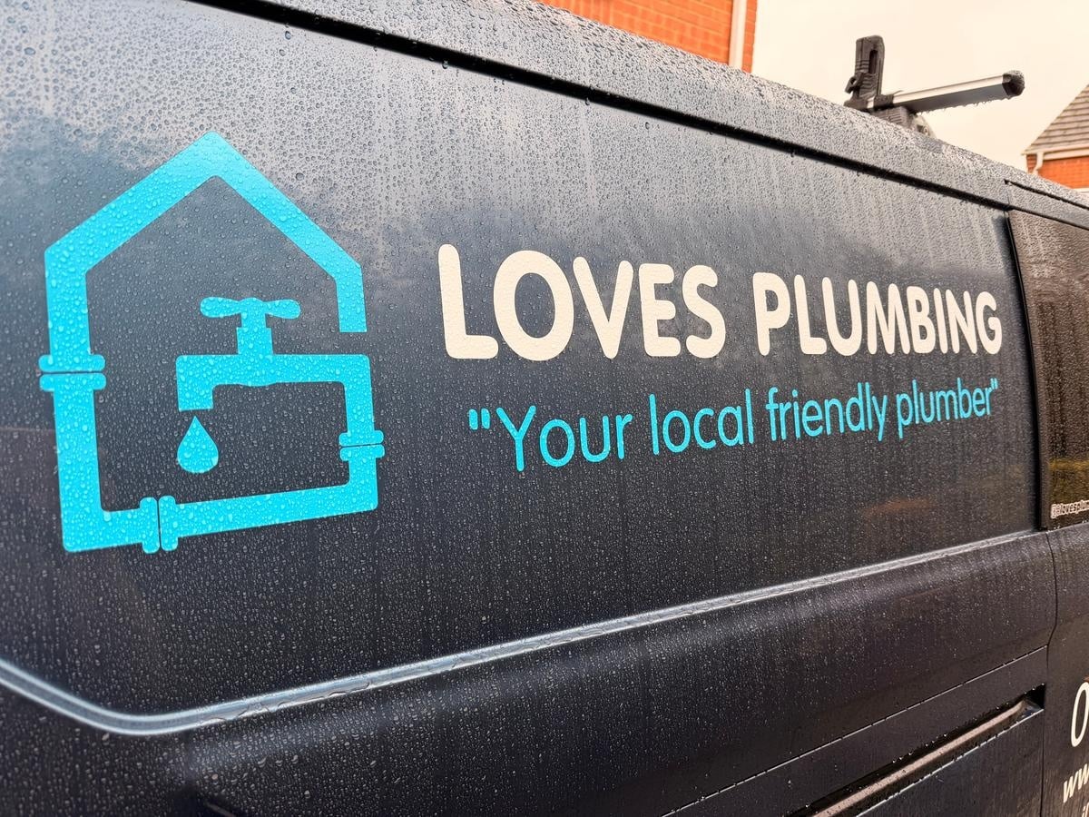 loves_plumbing_logo_on_van Loves Plumbing logo and slogan on the side of a wet van.